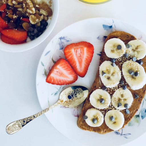 Healthy breakfast with eggs, toast, fruits, and coffee on a morning table