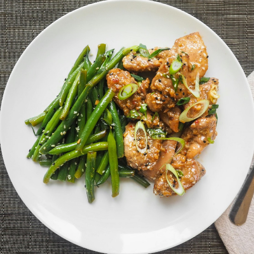 Delicious main dish with protein, vegetables, and sides on a dinner plate